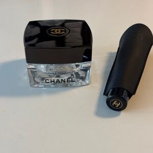 Chanel glass jar and makeup brush